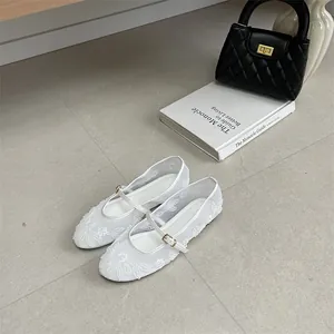 Elegant white mesh flat shoes with floral embroidery and classic Mary Jane strap