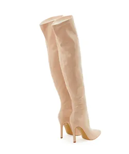 Elegant nude patent leather over-the-knee boots with high stiletto heels and pointed toe