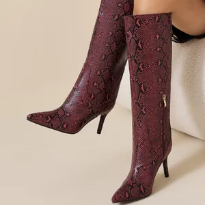 Chic red and black snakeskin pattern knee-high stiletto boots featuring a sharp pointed toe