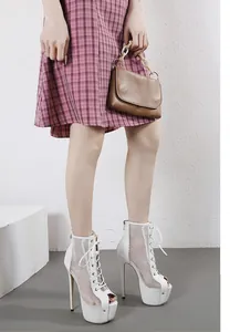 Side view of white peep-toe mesh stiletto sandals with high platform and lace-up front
