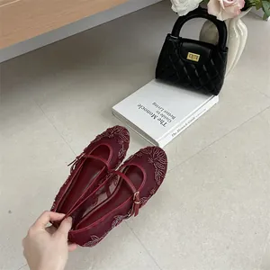 Exquisite burgundy mesh flat shoes showing intricate floral embroidery and beadwork detail