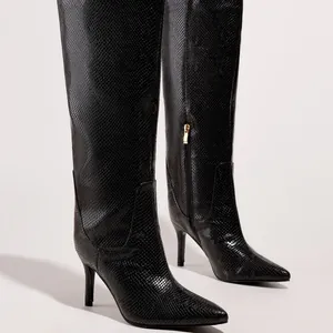 Fashionable black snakeskin knee-high boots with pointed toe and slim high stiletto heels