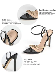 Detail view of black pointed toe stiletto sandals with gold chains and clear straps.