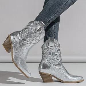 Metallic silver Western cowboy boots with intricate embroidery and chunky block heel