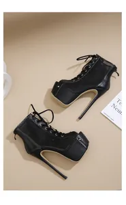 Close-up detail of black mesh stiletto platform heels with a lace-up front design