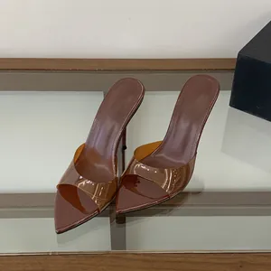 Brown pointed toe high heel mules with transparent strap and sleek stiletto heel design