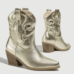 Vintage gold metallic Western cowboy boots with embroidered patterns and chunky heels