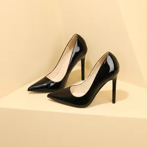 Elegant black patent leather stiletto high heels with sharp pointed-toe detail.