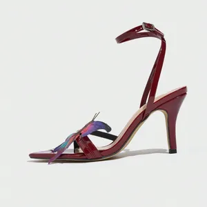 Detailed side view of wine red square toe stiletto sandals with colorful butterfly