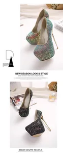 Detail view of shimmering glitter platform high heels with metallic stiletto heels.