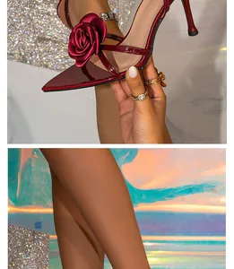 Elegant macro shot of wine red patent leather high heel featuring a delicate 3D satin rose