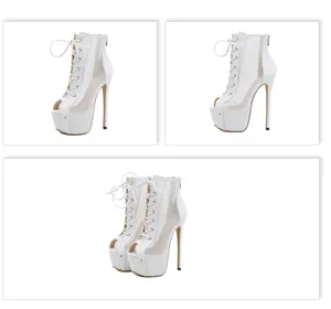 Detailed view of women's white platform lace-up peep-toe ankle boots with mesh panels