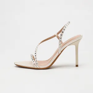 Elegant off-white satin high heel sandals with sparkling rhinestone straps for banquets.