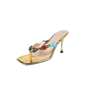 Elegant Bohemian gold high heel thong sandals decorated with vibrant colorful stones