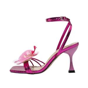 Elegant fuchsia square toe sandals featuring a 3D orchid flower and ankle strap stiletto heels