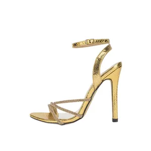 Luxurious gold rhinestone stiletto sandals with snakeskin texture and buckle ankle strap