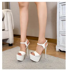 Close-up detail of stylish white platform stiletto high heel sandals worn by a model