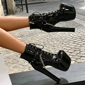 Black patent leather platform chunky heel boots with metal chain and lace-up detail