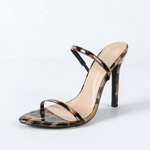 Elegant leopard print stiletto sandals with thin straps and round toe.