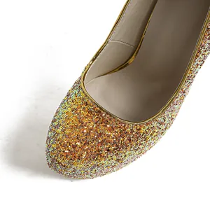 Close-up of sparkling iridescent sequins on a round-toe high heel shoe