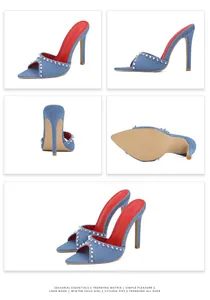 Detailweergave van blauwe denim mules met puntige neus, studs en rode zolen