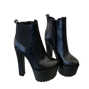 Detailed view of black platform Chelsea boots with 16cm chunky heels and side zippers