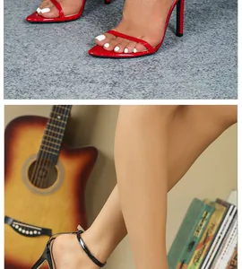 Close-up of elegant patent leather stiletto sandals with thin ankle straps and open toe.