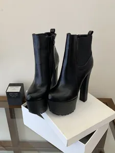 Close-up of black 16cm platform chunky heel Chelsea boots with side zipper detail