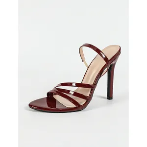 Elegant burgundy patent leather stiletto sandals with thin straps for evening party wear