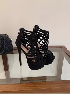 Detail view of 16cm black cutout stiletto heels with a sexy platform for stage catwalks.