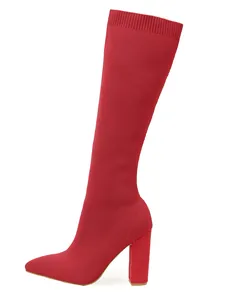 Side view of red knit stretch high heel boot showing fabric texture