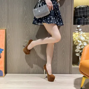 Elegant brown suede platform stiletto pumps featuring high heels and waterproof soles.