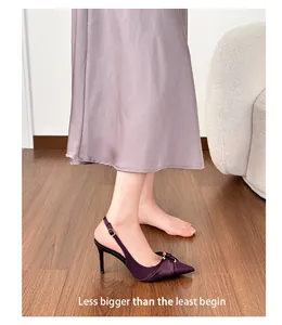Elegant purple pleated pointed-toe stiletto slingback heels with metal buckle detail.