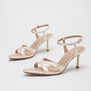 Elegant champagne satin crossover strap stiletto sandals with ankle buckle for women