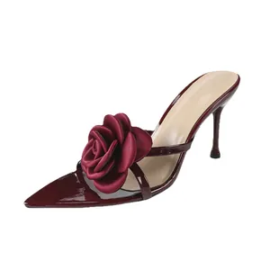 Elegant burgundy pointed toe high heel mules featuring a large 3D satin rose ornament