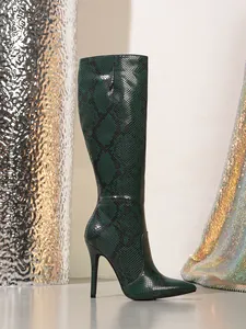 Elegant dark green snake skin knee high boots with pointed toe and stiletto heel.
