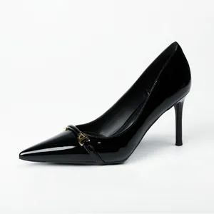 Elegant black patent leather high heels with a pointed toe and gold buckle detail