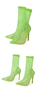High-angle view of neon green mesh ankle boots featuring sparkling rhinestone embellishments.