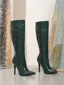 Stylish emerald green snakeskin knee-high boots with pointed toe and stiletto heel.