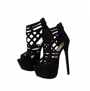 Detail view of 16cm black platform stilettos with elegant hollow-out lattice design