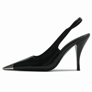 Elegant black patent leather slingback heels with metallic pointed toe cap
