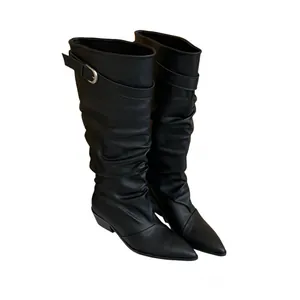 Elegant black pointed-toe slouchy boots with buckle detail, studio shot on white background.