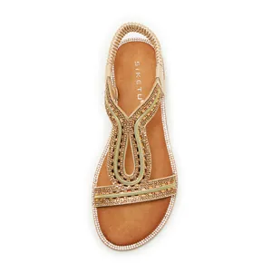 Elegante sandalo basso stile bohémien con strass scintillanti e cinturino elastico