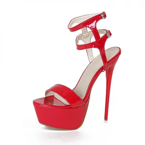 Detailed view of red patent leather high heel sandal with double ankle strap and platform