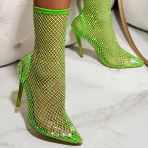 Stunning lime green fishnet stiletto ankle boots featuring sparkling rhinestone details