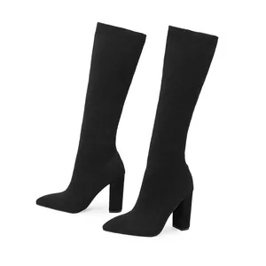 Elegant black knit stretch knee-high boots with chunky high heels and pointed toes.