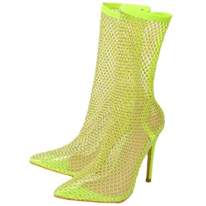 Stunning neon green mesh ankle boots with glittering rhinestones and elegant stiletto heels.