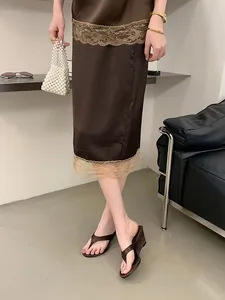 Detailed view of elegant brown wedge flip-flop sandals with a French-style design