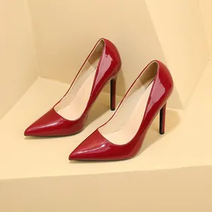 Detailed view of elegant red patent leather pointed-toe stiletto high heel pumps for women