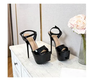 Side view of black patent leather platform sandals with stiletto heels